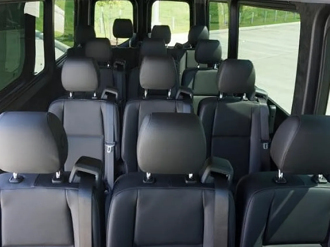 Forward-facing interior of 14 passenger Ford Transit shuttle